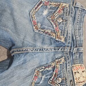 Stylish Women's Blue Jeans with Embroidered Pockets